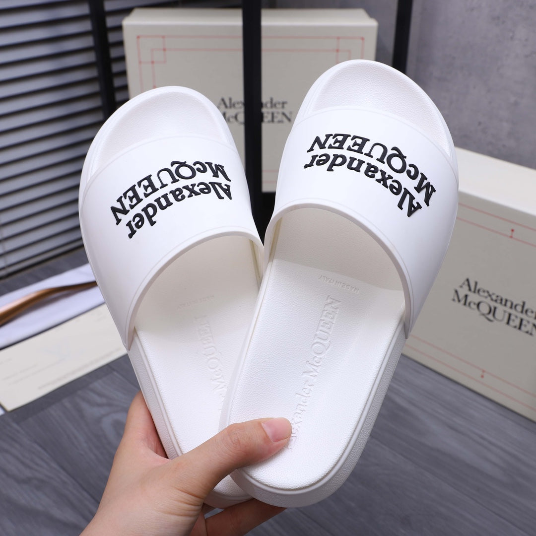 Alexander McQueen white slide sandals showing inner footbed with logo
