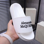 Alexander McQueen white leather slide sandal with black logo on strap