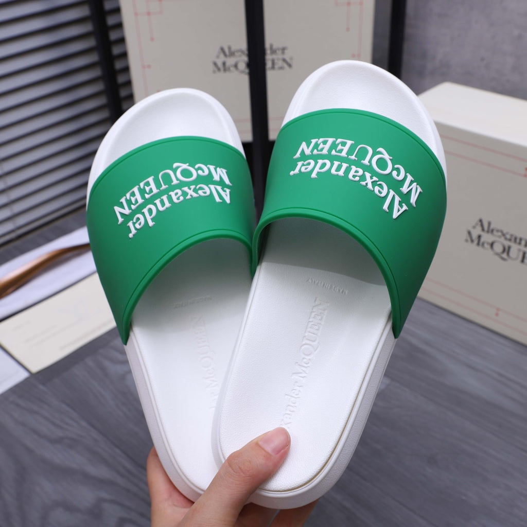 White slide sandals with green logo bands, inner view