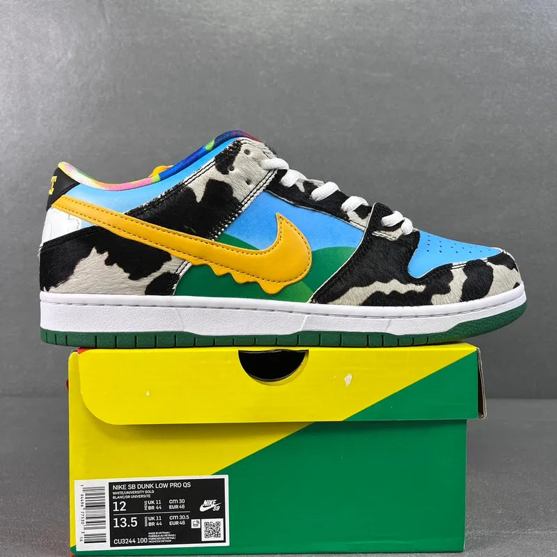 SB Dunk Low sneaker in blue and green with yellow swoosh, black-and-white cow print