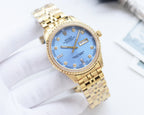 Two-tone Rolex watch with blue dial, gold bezel, and metal link bracelet
