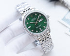 Rolex watch with green dial and silver metal bracelet, diamond hour markers