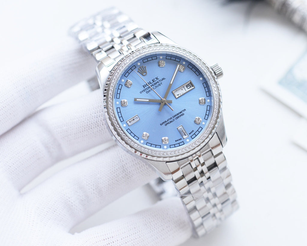 Rolex watch with blue dial and silver metal bracelet, date window at 3 o'clock