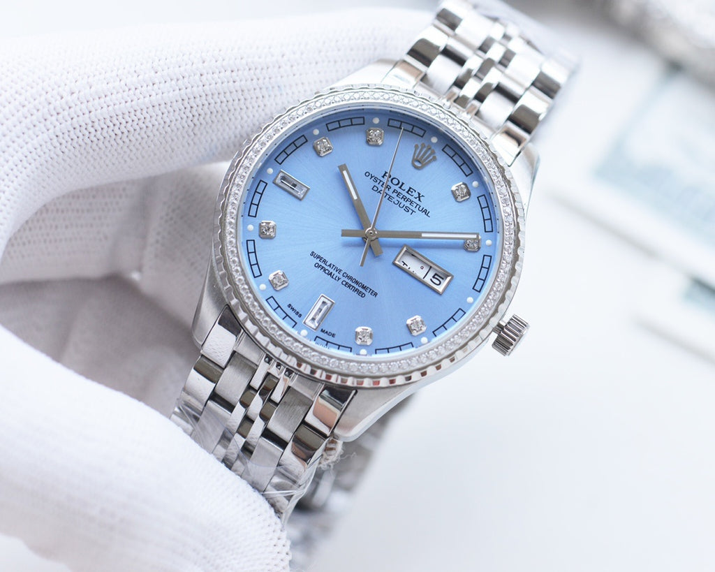 Rolex watch with blue dial and silver metal bracelet, diamond hour markers