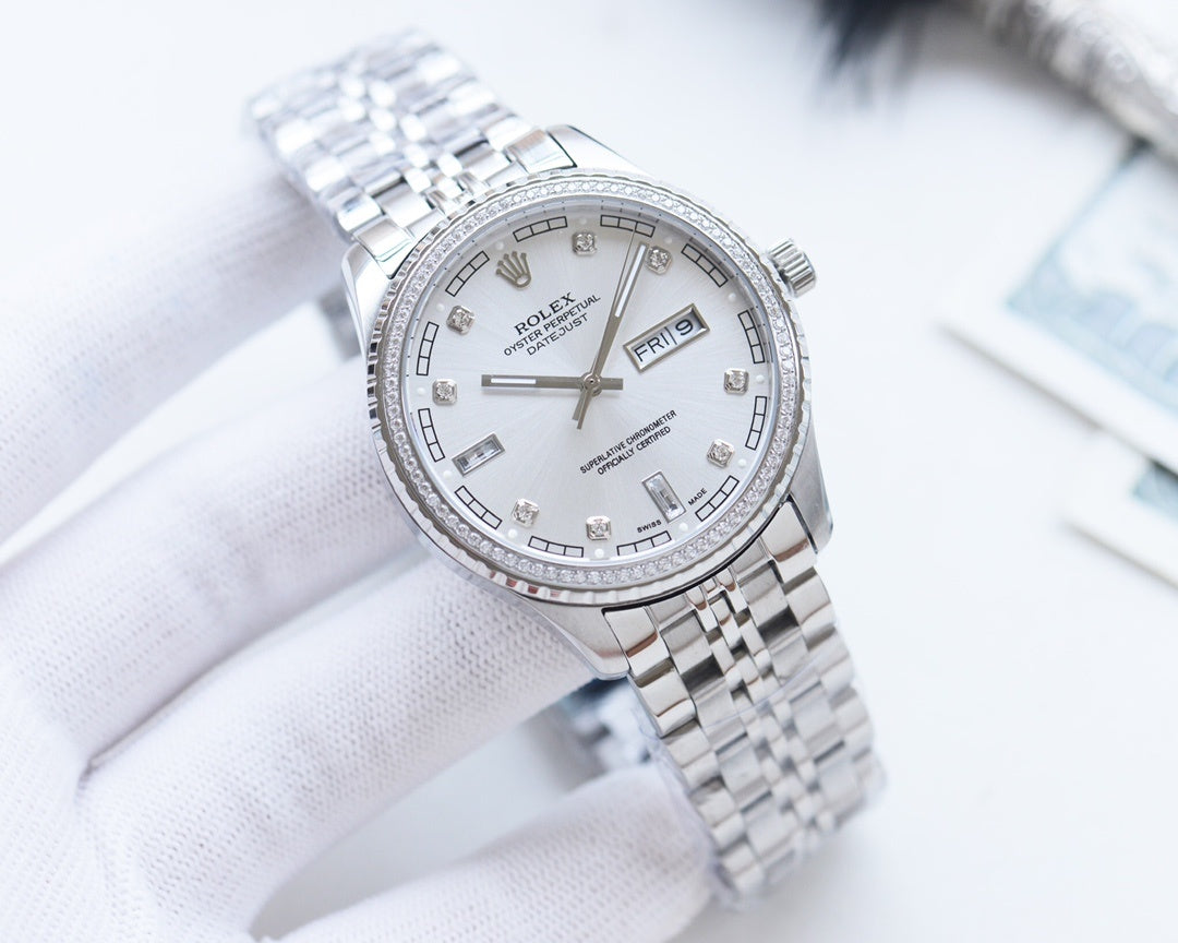 Rolex watch with white dial and silver metal bracelet, date window at 3 o'clock