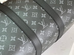 Louis Vuitton monogram duffel with dark trim and curved top edge detail