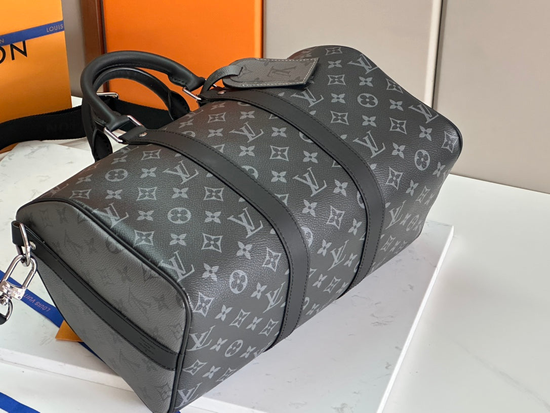 Louis Vuitton monogram duffel bag with dual top handles and shoulder strap
