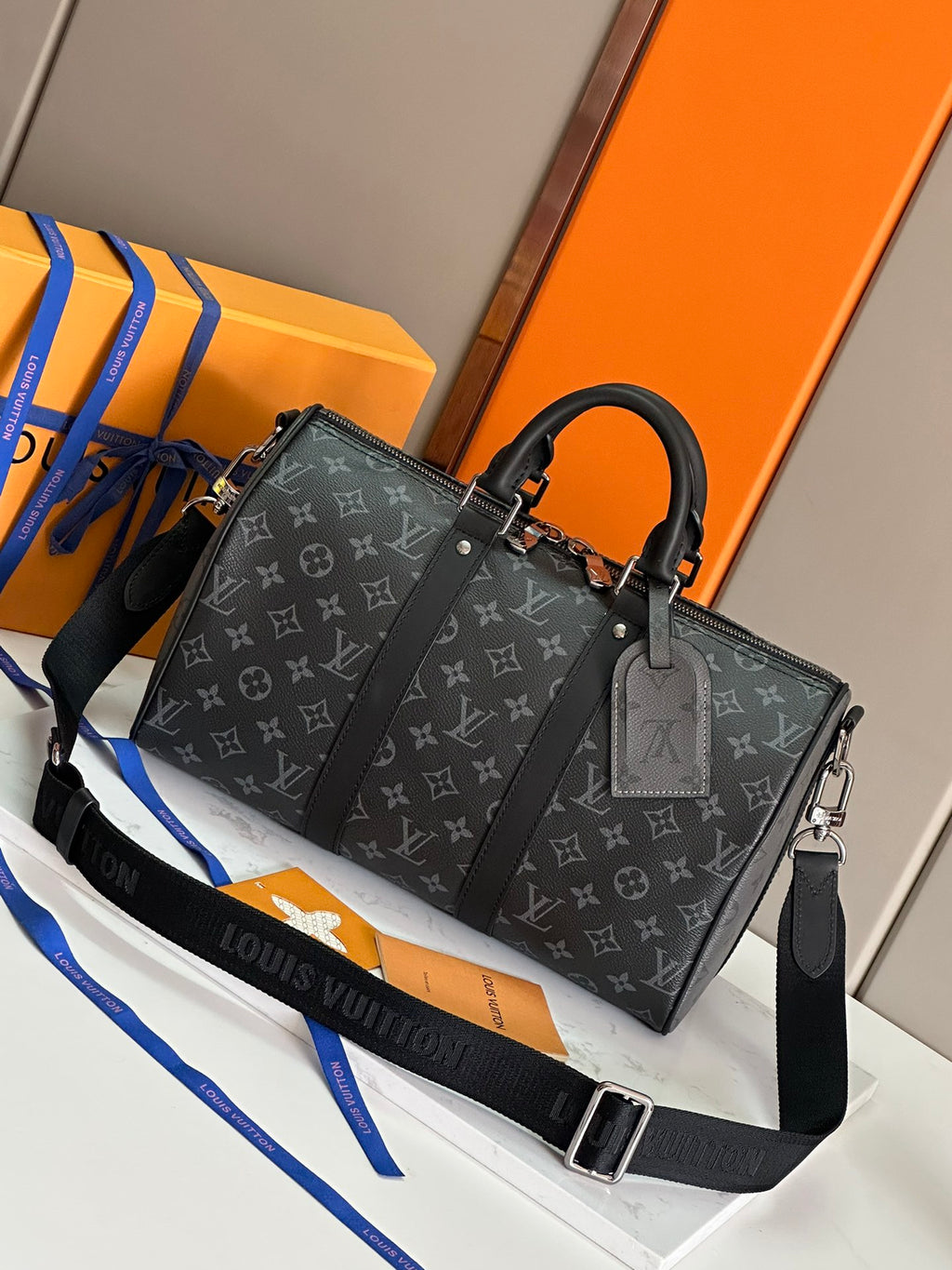 Louis Vuitton monogram handbag with top handles and front zipper pocket