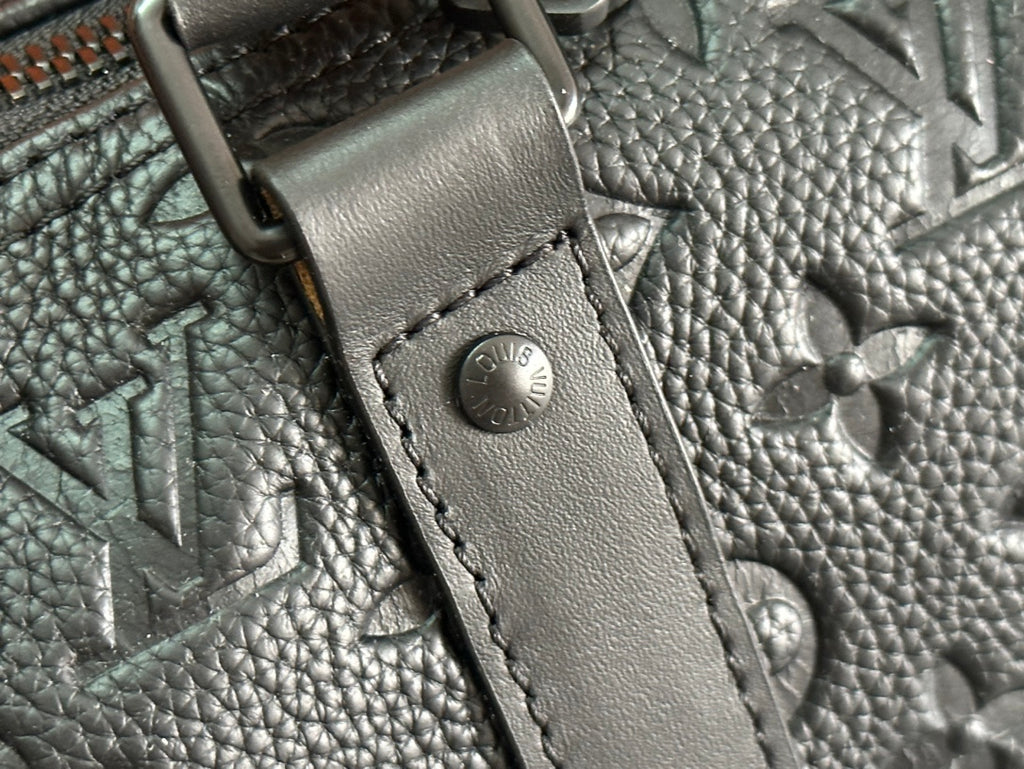 Men's Louis Vuitton monogram leather strap attachment with metal hardware