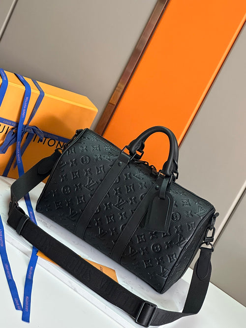 Men's Louis Vuitton monogram leather bag with top handles and wide shoulder strap