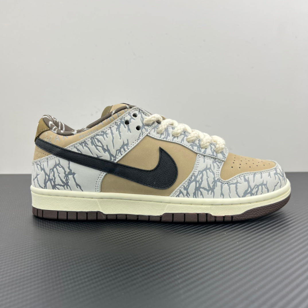 Nike Dunk SB low-top sneakers, blue-and-white patterned upper with black swoosh and tan overlays