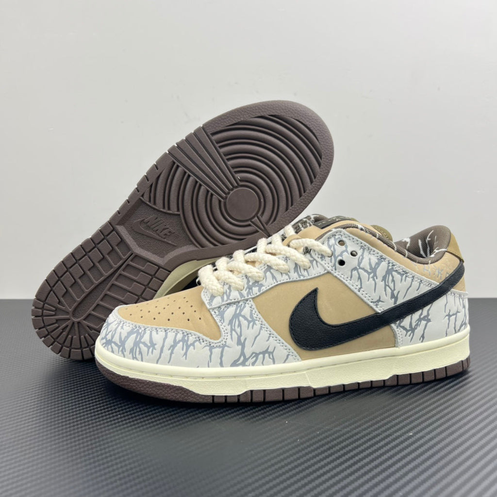 Nike Dunk SB sneakers showing textured dark outsole and blue-white patterned upper