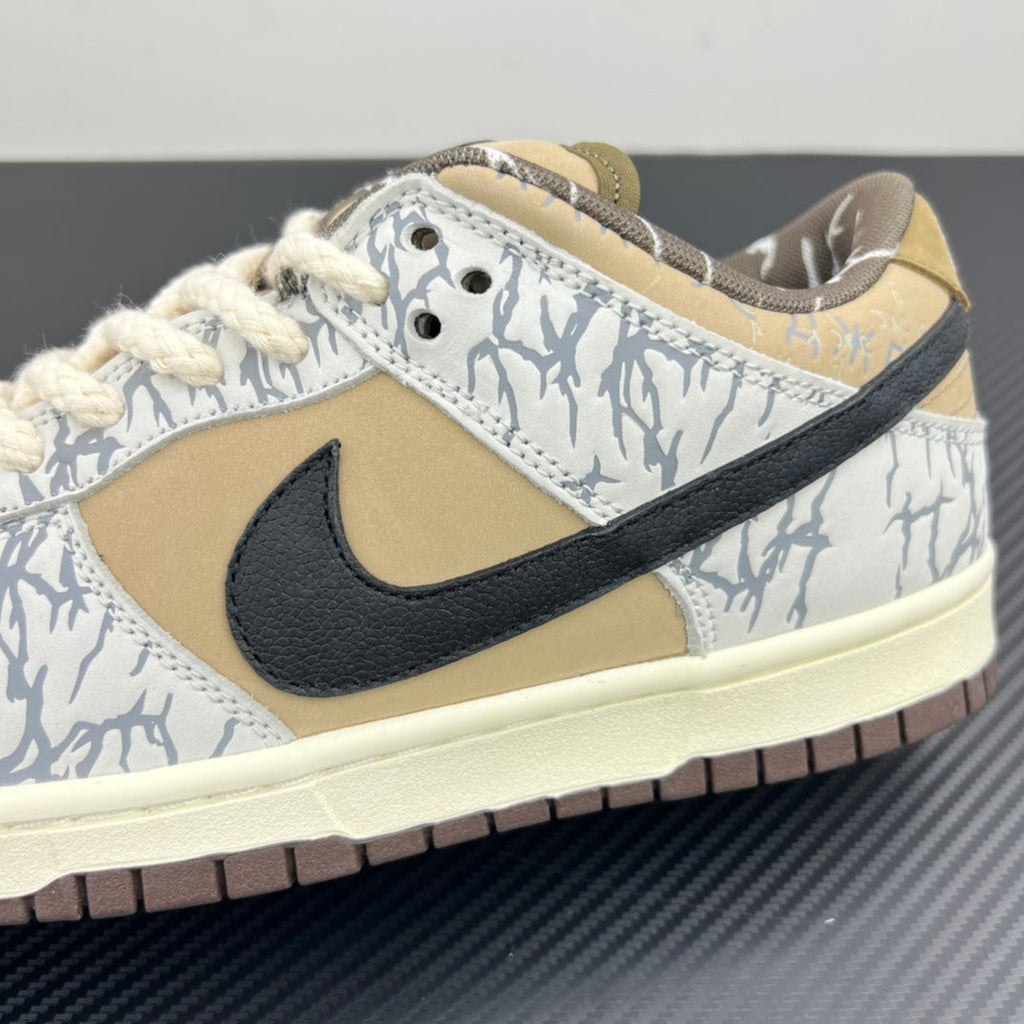 Nike Dunk SB low-top sneakers close-up: black swoosh, blue-white patterned leather, light midsole