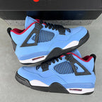 Pair of light blue and black Air Jordan 4 sneakers on a box, red lining