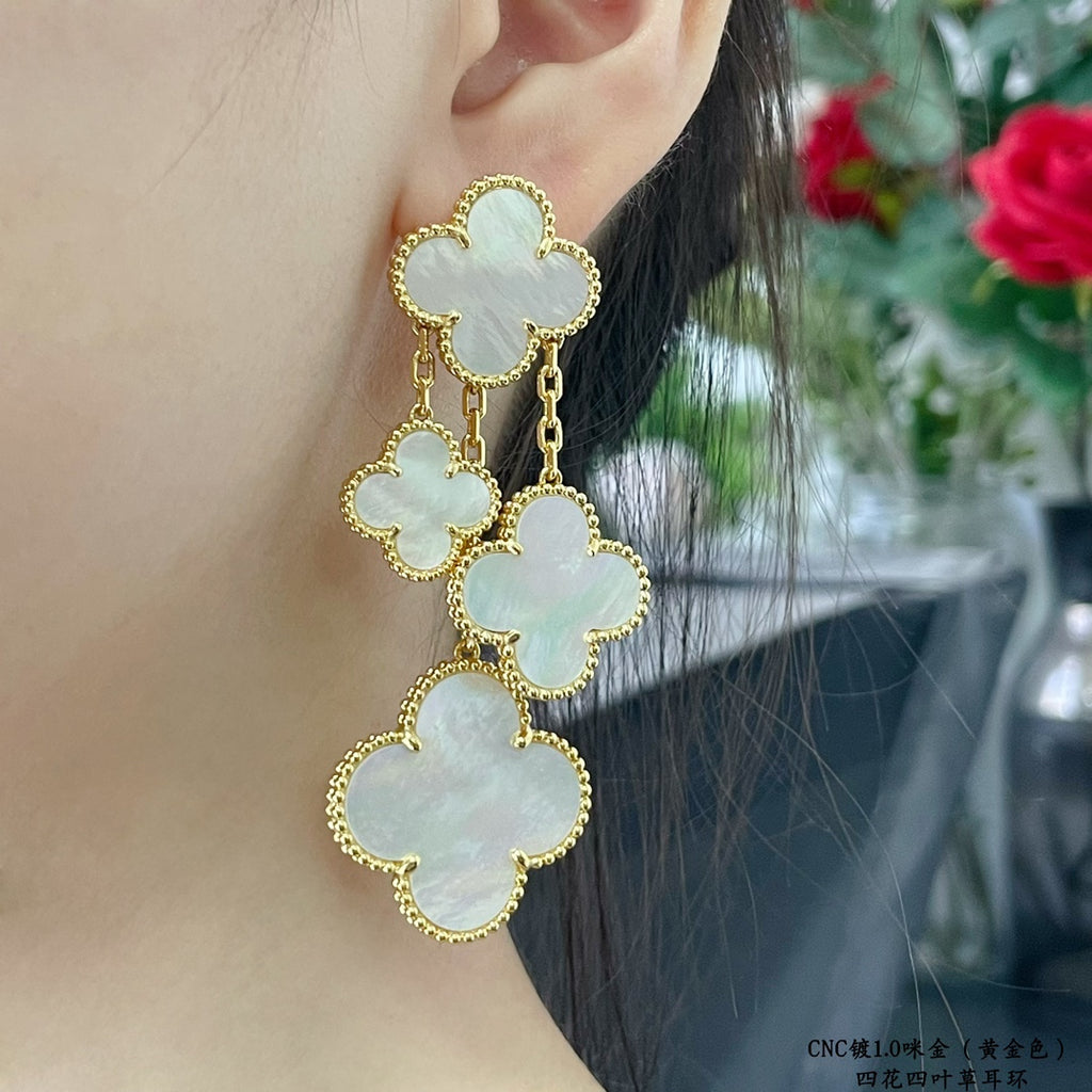 Gold-tone clover mother-of-pearl dangle earrings with cascading chain charms