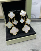 Clover dangle earrings with gold-tone chains and mother-of-pearl charms in box