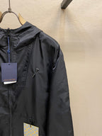 Black hooded jacket detail, full-zip front and hood with logo hardware