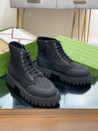 Gucci high-top lace-up sneakers with dark monogram pattern and chunky lug sole