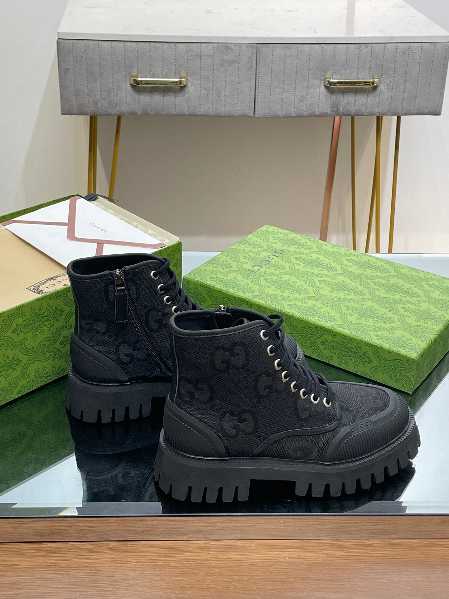 Gucci unisex high-top sneakers in dark gray with side zipper detail and lug sole