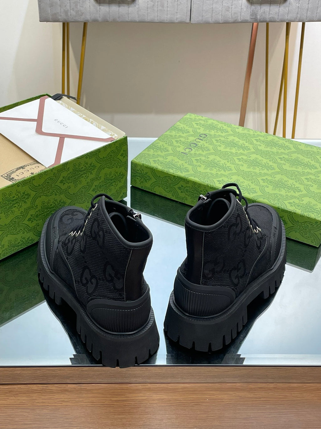 Pair of Gucci high-top sneakers, dark gray, with lace-up fronts and chunky tread