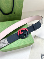 Gucci belt with navy leather strap and pink-red circular G buckle