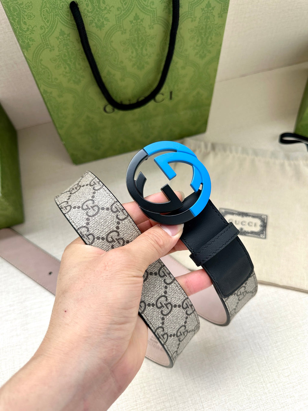 Gucci belt with navy leather strap and circular blue G buckle