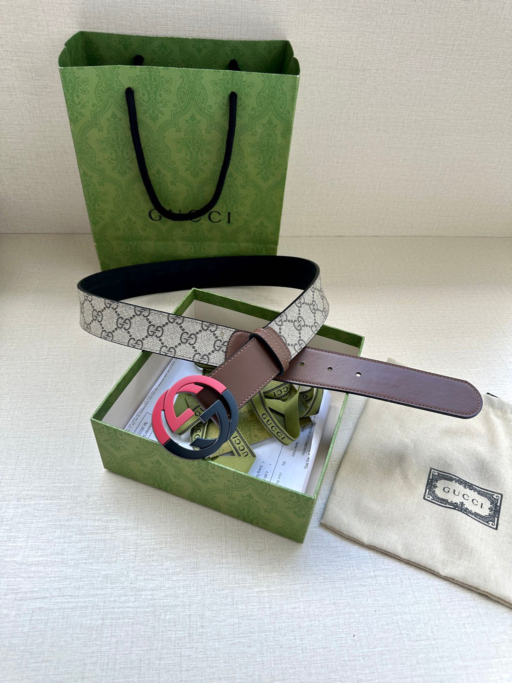 Brown and beige belt with GG canvas strap and round black buckle, in gift box