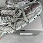 Balenciaga sneaker upper close-up with mesh panels and lace details