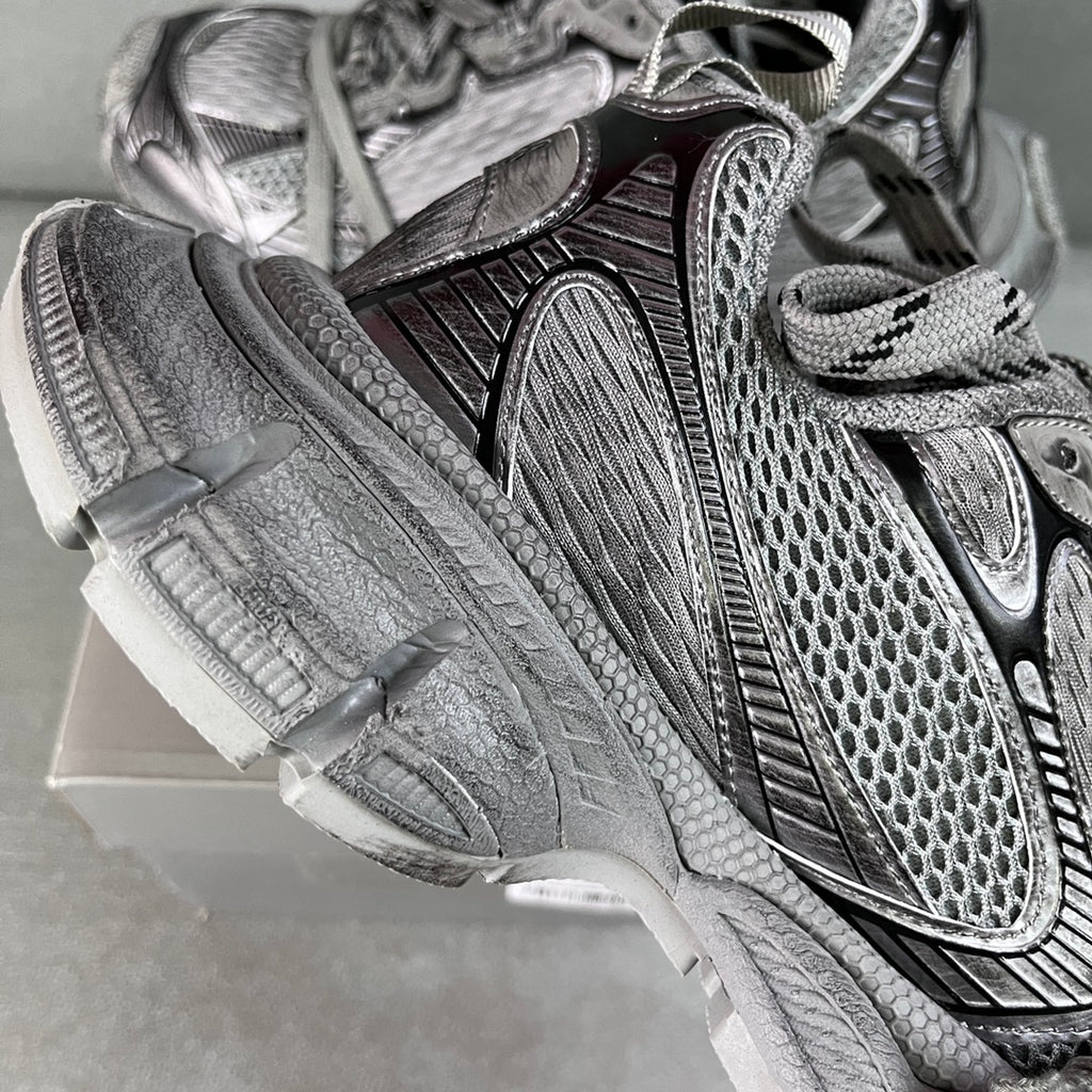 Balenciaga sneaker upper close-up with textured panels and lace-up straps