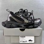 Black and silver Balenciaga sneakers on box, chunky sole, black mesh and metallic trim