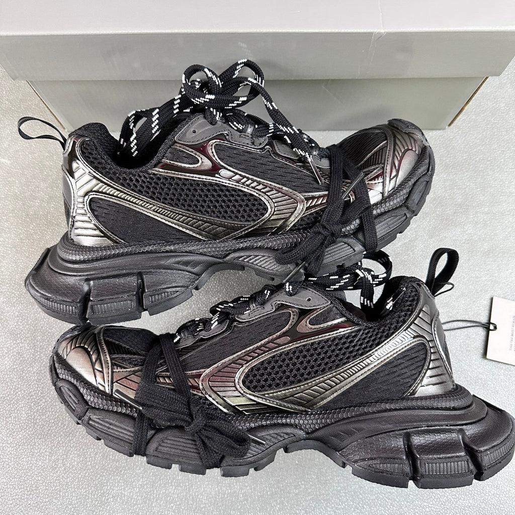 Black and silver Balenciaga chunky sneakers with black laces and textured panels