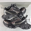 Black and silver Balenciaga chunky sneakers with black laces and textured panels