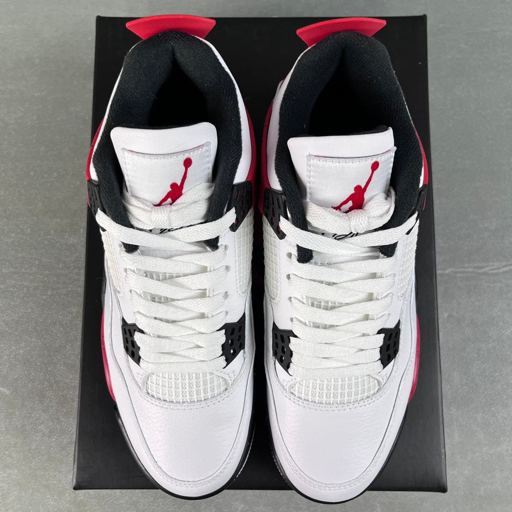 Air Jordan 4 sneakers, white uppers with red lining and black ankle collar