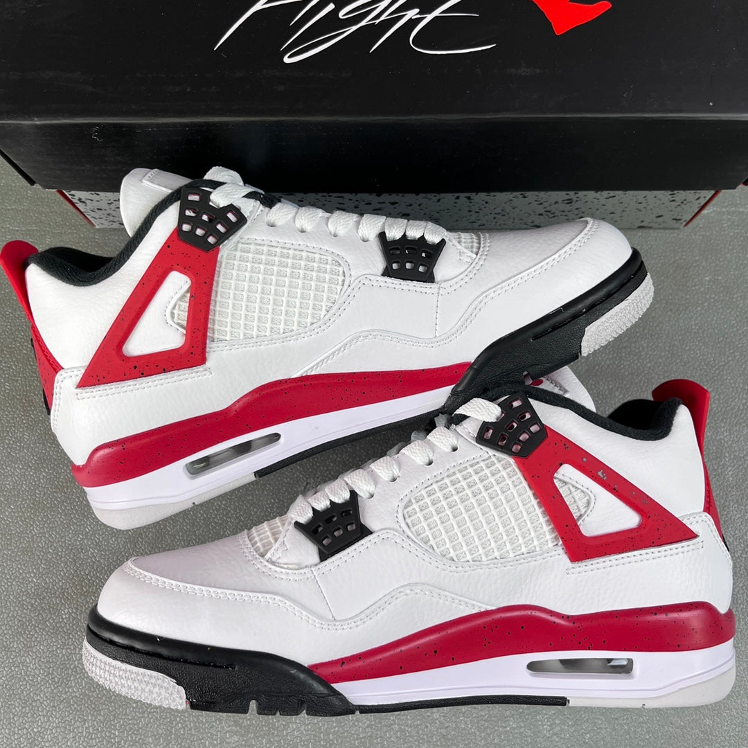 Air Jordan 4 sneakers pair, white leather with red midsole and black outsole