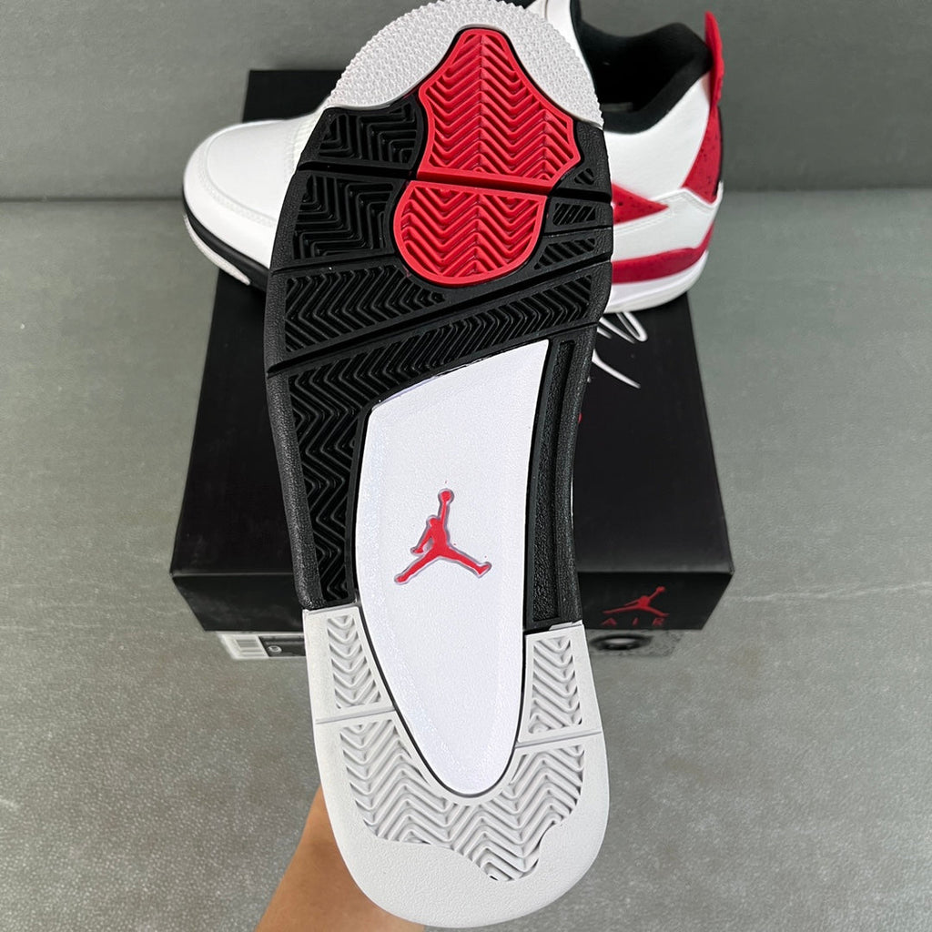 Air Jordan 4 sneaker outsole and heel, black traction tread with red Jumpman