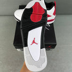 Air Jordan 4 sneaker outsole and heel, black traction tread with red Jumpman