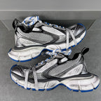 Balenciaga unisex sneakers pair, gray and black uppers with white laces and blue soles