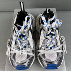 Balenciaga unisex sneakers rear view, gray uppers with white laces and blue heel panels