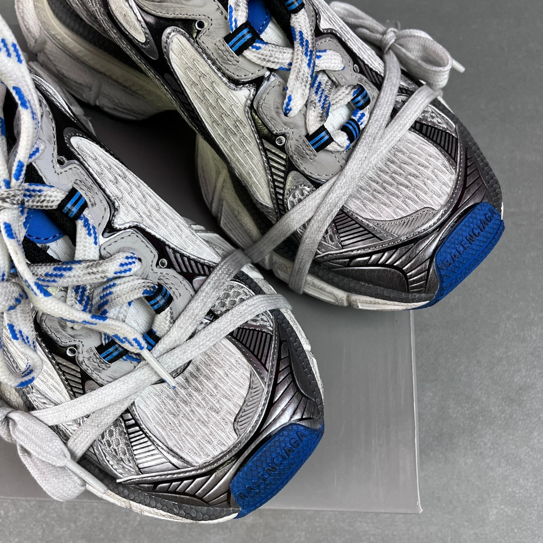 Balenciaga unisex sneakers toe and side detail, gray uppers, laces, black trim, blue soles