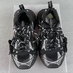 Balenciaga unisex sneakers rear view, black with white accents, lace-up, padded collar