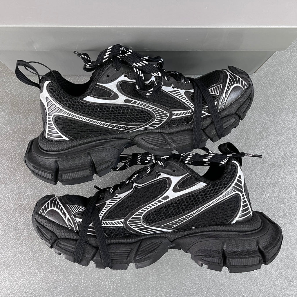Balenciaga unisex sneakers pair, black with white side stripes, lace-up, chunky sole