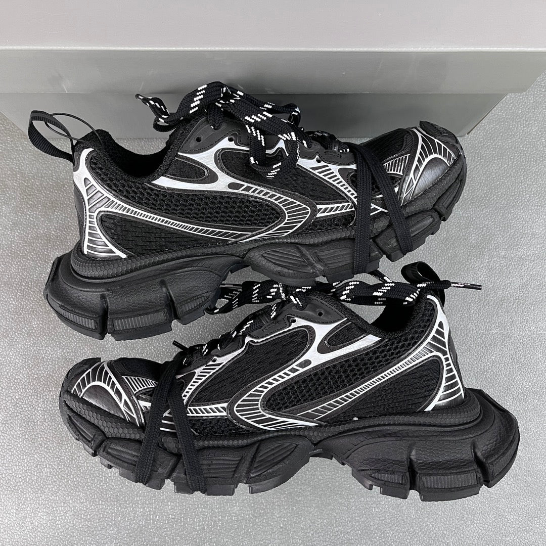 Balenciaga unisex sneakers pair, black with white side stripes, lace-up, chunky sole
