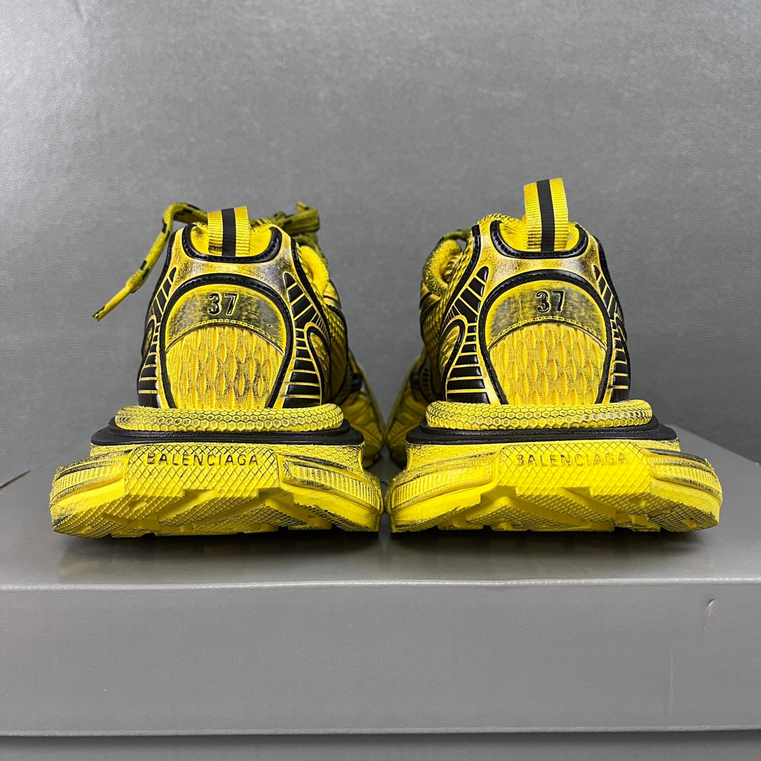 Balenciaga sneakers heel view in yellow with size 37 markings and green laces