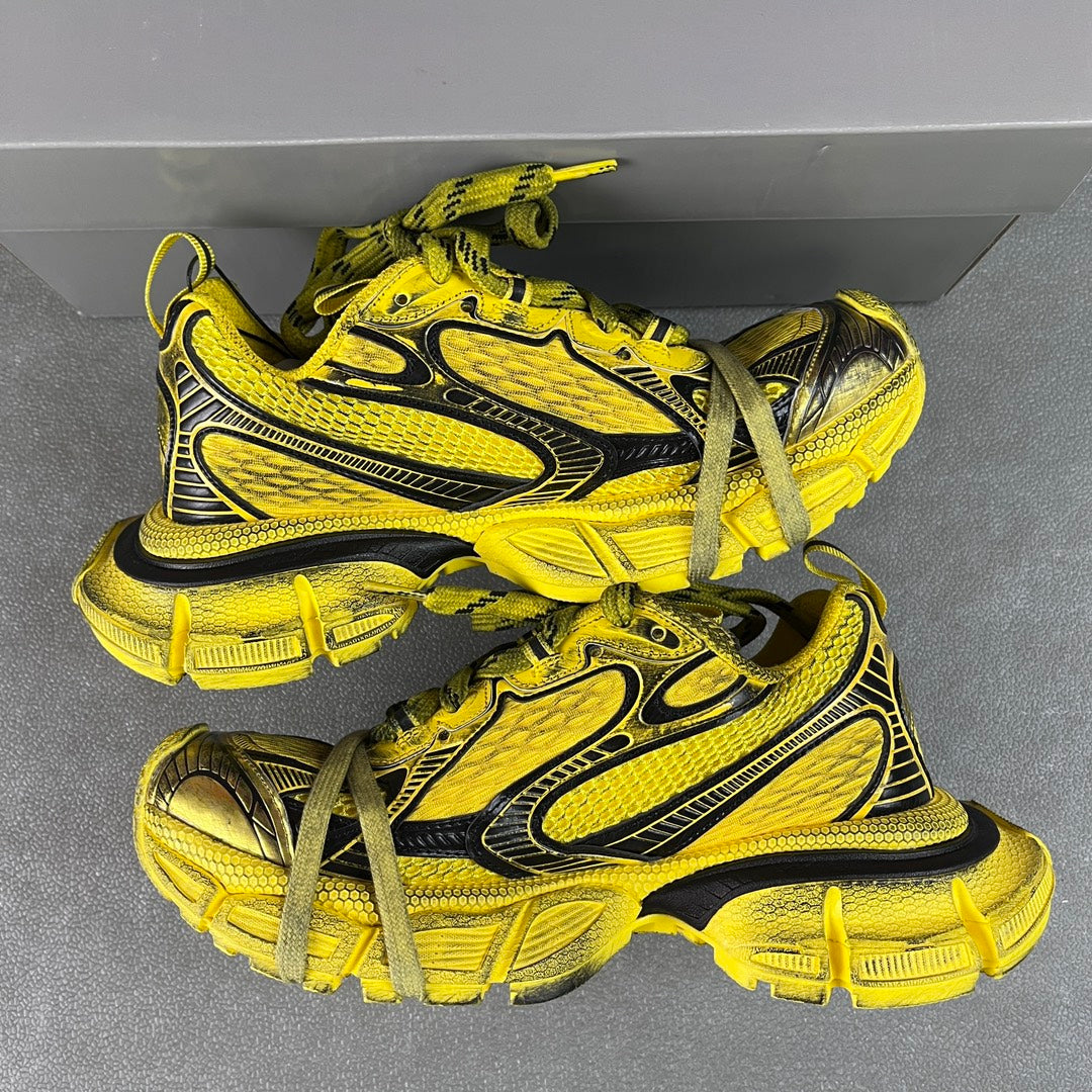 Balenciaga unisex sneakers in yellow with black trim, green laces and thick sole