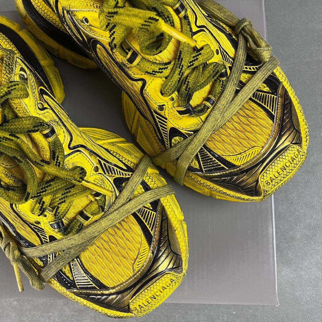 Balenciaga sneakers with heel logo, yellow uppers with black detail and green laces