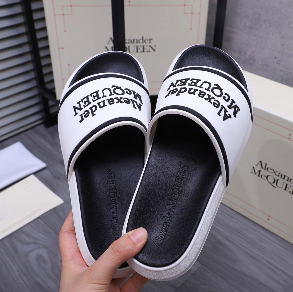 Alexander McQUEEN slide sandals, view of white outer soles and black footbed