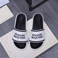 Alexander McQUEEN slide sandals, white and black with logo strap band