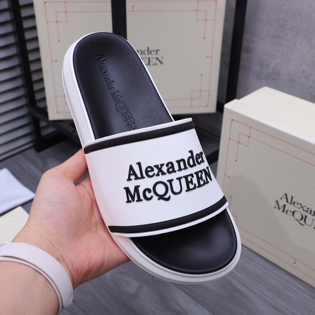 Alexander McQUEEN slide sandal close-up, white band with black logo on strap