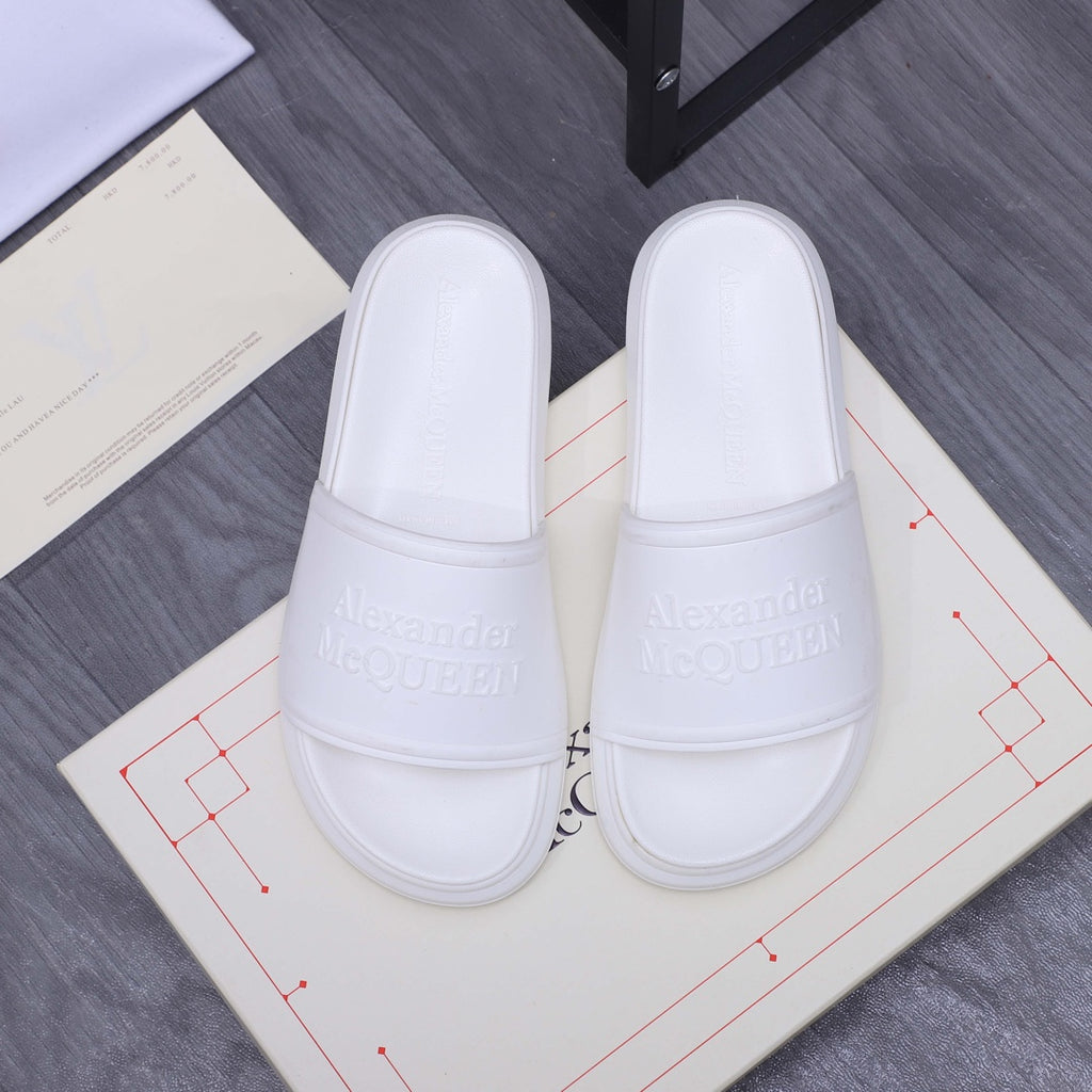 Alexander McQueen white slide sandals with wide padded strap and embossed logo