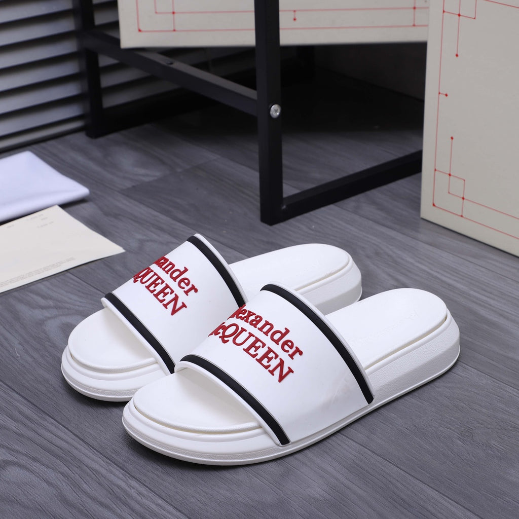 White slide sandals with black strap band and red Alexander McQUEEN print
